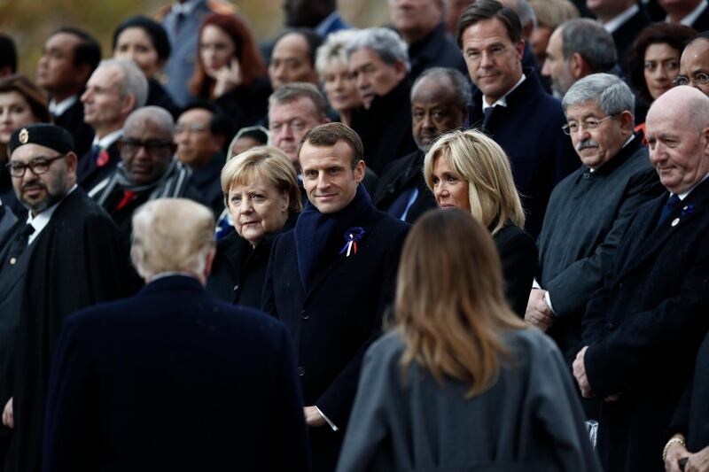 epa07157775 U.S. President Donald J.Trump (L) and US first lady Melania Trump (R) arrive to take their place with French President Emmanuel Macron (C), french first lady Brigitte Macron (C-R) and German Chancellor Angela Merkel (C-L) during the international ceremony for the Centenary of the WWI Armistice of 11 November 1918 at the Arc de Triomphe, in Paris, France, 11 November 2018. World leaders have gathered in France to mark the 100th anniversary of the First World War Armistice with services taking place across the world to commemorate the occasion.  EPA/BENOIT TESSIER / POOL MAXPPP OUT