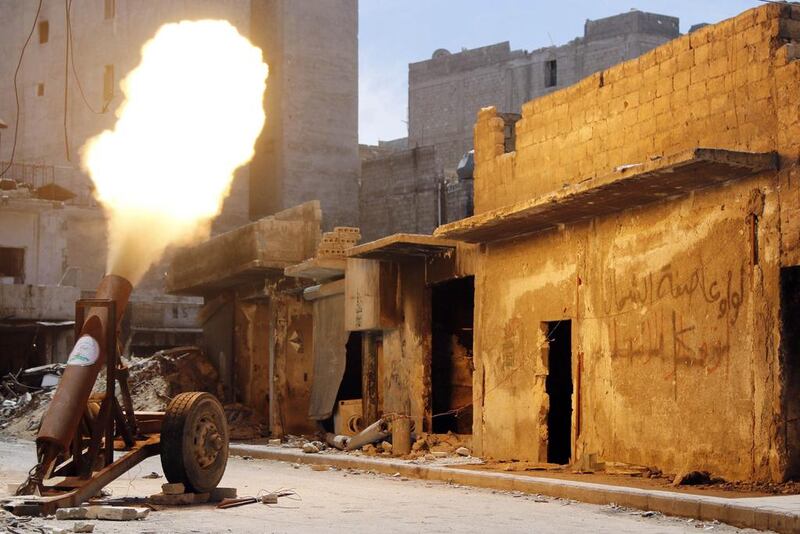 Free Syrian Army fighters fire a self-made rocket towards forces loyal to Syria’s President Bashar al-Assad in Bustan al-Basha district in Aleppo.  Hosam Katan / Reuters