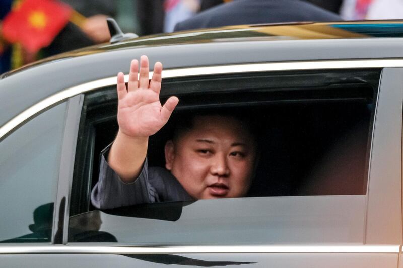 Kim Jong-un waves from his car after arriving by train at Dong Dang railway station near the border with China on February 26, 2019 in Lang Son, Vietnam. Getty Images