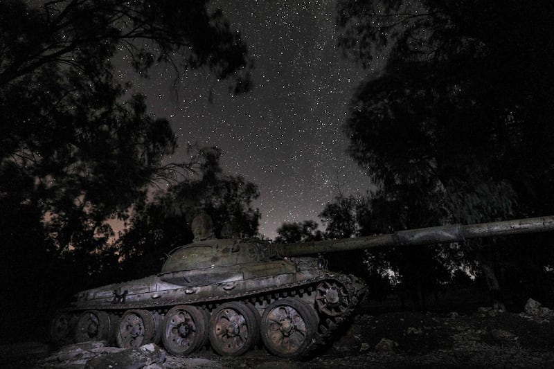 This long-exposure picture taken shows a view of the Milky Way galaxy rising in the sky above a destroyed Russian-built T-55 tank in Syria's rebel-held city of Idlib, as the Milky Way galaxy is seen in the night sky above.  /AFP