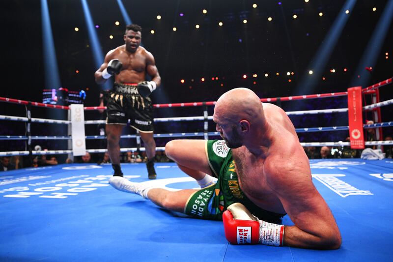 Tyson Fury hits the canvas after being knocked down by and Francis Ngannou. Getty