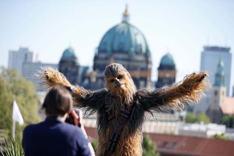 A person dressed up as Chewbacca character poses during a photocall to promote the new Star Wars Movie 'Solo: A Star Wars Story' in Berlin, Germany. Axel Schmidt / Reuters