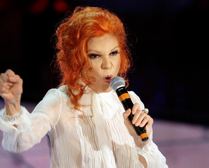 Italian singer Maria Ilva Biolcati, knowns as Milva, performs "The show must go on" during the Sanremo Italian song contest, in San Remo, Italy. Milva has died at her home in Milan at the age of 81, Italy's culture minister announced on Saturday. AP Photo