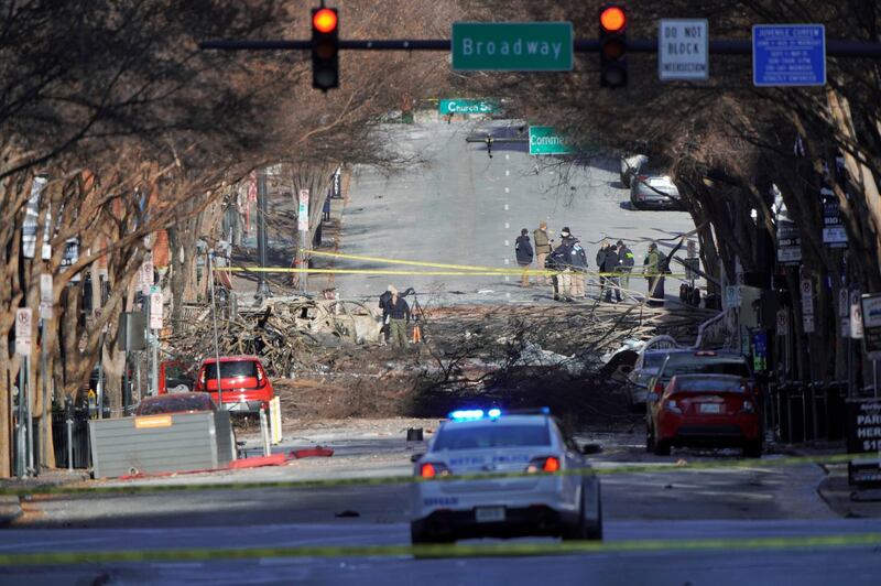 Investigators work near the site of an explosion on 2nd Avenue that occurred the day before in Nashville, Tennessee, U.S.  REUTERS