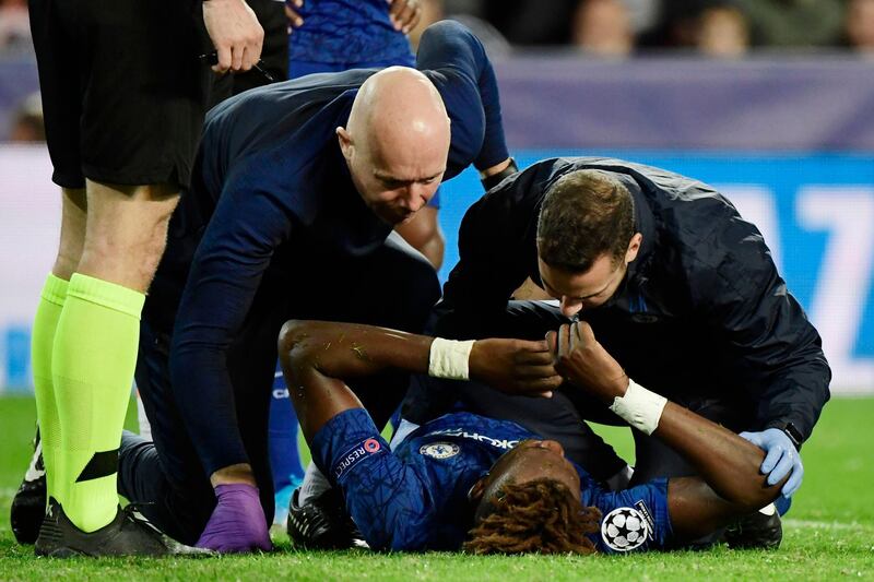 CHelsea medical staff check on Tammy Abraham. AFP