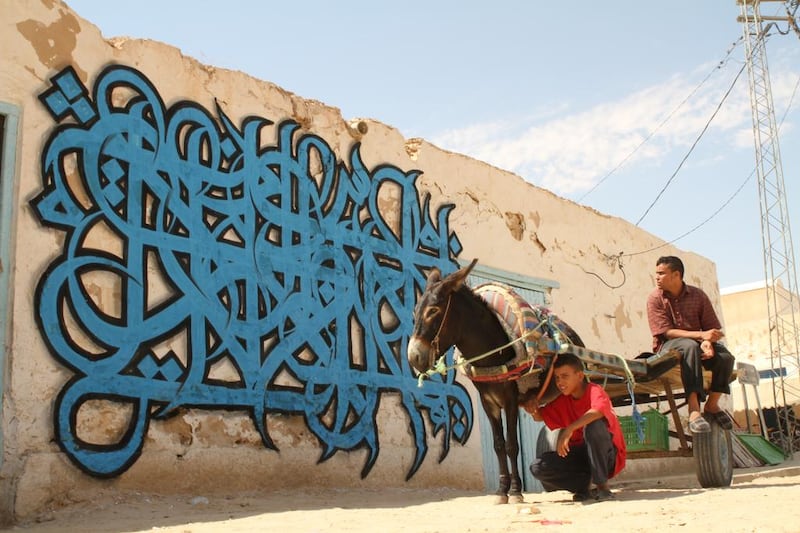 Photos of El Seed from his upcoming book, Lost Walls. This is in Douz, Tunisia.

CREDIT: Courtesy El Seed