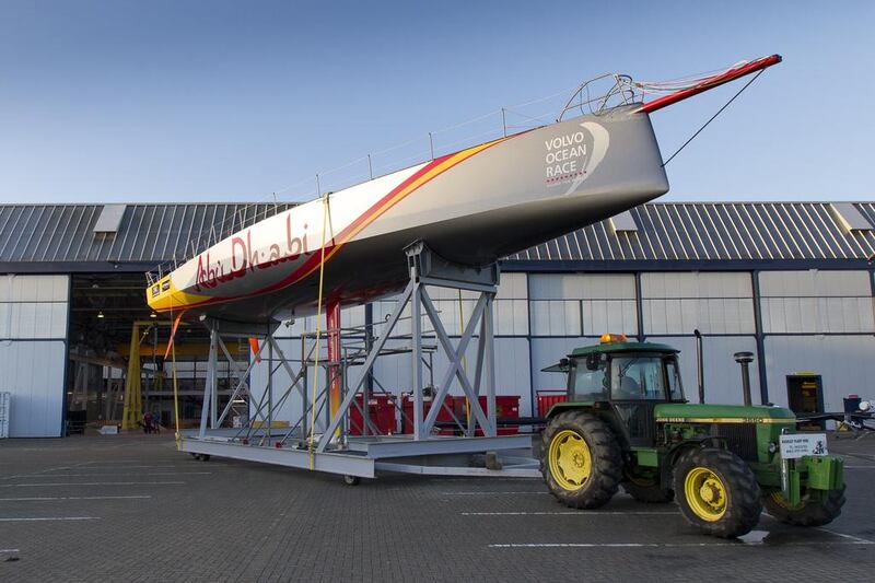 Abu Dhabi Ocean Racing's new Volvo Ocean 65 emerges from the Green Marine boat yard in Southampton, England, for the first time on February 26, 2014. Courtesy Ian Roman / Abu Dhabi Ocean Racing