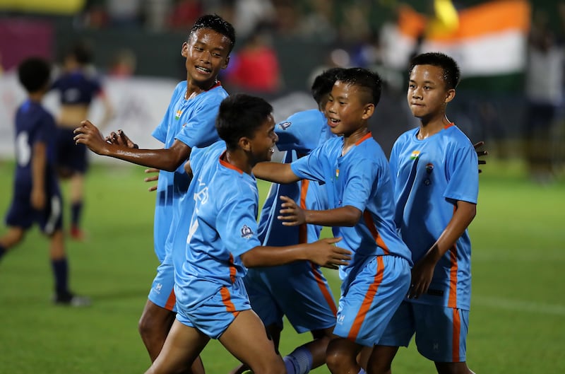 Players of India's Minerva Academy celebrating after winning the U12 Mina Cup final against La Liga HPC Academy on Monday, April 11, 2022 at Jebel Ali Centre of Excellence in Dubai. All photos Pawan Singh / The National 