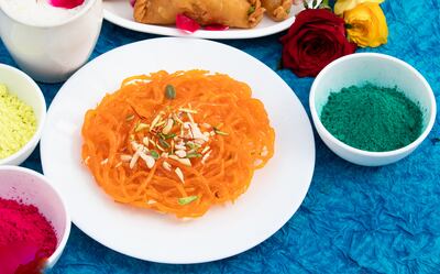 Dishes eaten during the festival include gheeyar, a sweet, sticky, orange sweetmeat akin to jalebi. Getty Images