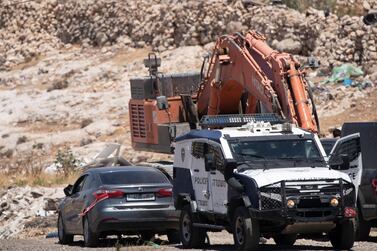 Israeli police tow a car they said was used in an attack near Hizmeh Junction in the West Bank. AP 