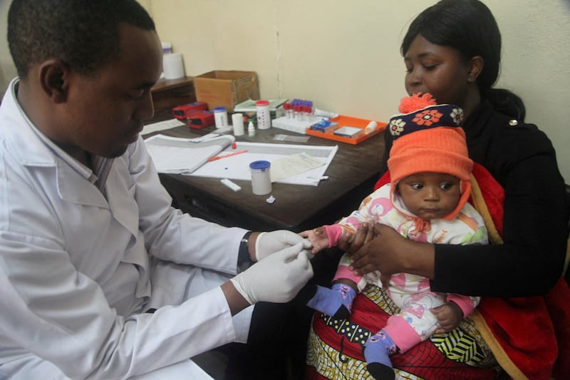 A doctor tests a child for malaria at the Ithani-Asheri Hospital in Arusha, Tanzania. Reuters
