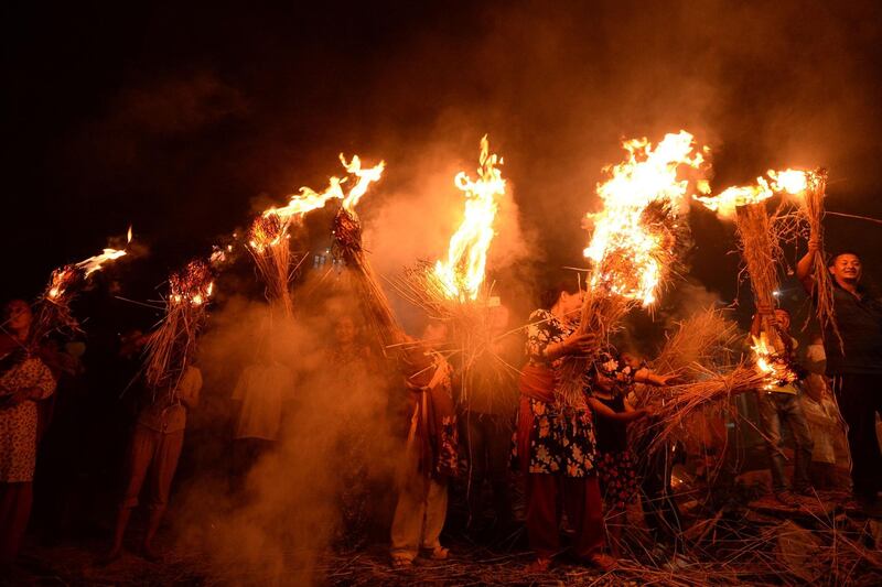 Nepalese Hindus carry traditional torches on the last day of the Rato Machindranath chariot festiva in Bungamati, on the outskirts of Kathmandu. AFP