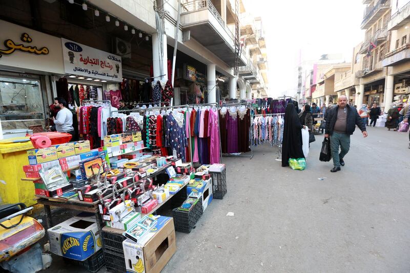Iraqis shop at the al-Rasheed street in central Baghdad. EPA