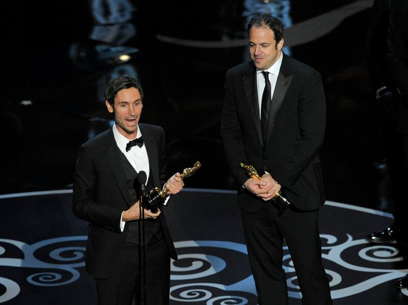 Malik Bendjelloul, left, and Simon Chinn accept the award for best documentary feature for "Searching for Sugar Man" during the Oscars at the Dolby Theatre on Sunday Feb. 24, 2013, in Los Angeles.  (Photo by Chris Pizzello/Invision/AP) *** Local Caption ***  85th Academy Awards - Show.JPEG-0e1d8.jpg