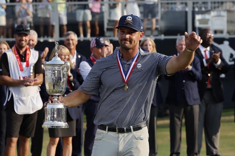 Bryson DeChambeau celebrates with the US Open trophy after winning the 2024 tournament at Pinehurst No 2. EPA