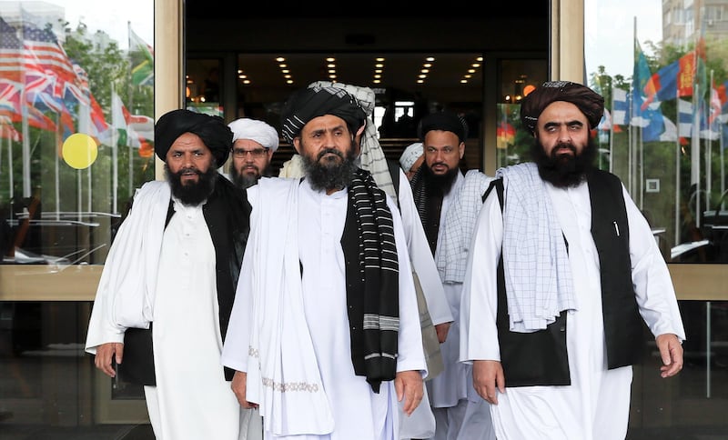 Members of a Taliban delegation, led by chief negotiator Mullah Abdul Ghani Baradar (C, front), leave after peace talks with Afghan senior politicians in Moscow, Russia May 30, 2019. REUTERS/Evgenia Novozhenina