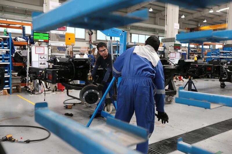 Workers at the NIMR military vehicle production facility in the Tawazun Industrial Park in the Al Ajban area north of Abu Dhabi. Christopher Pike / The National