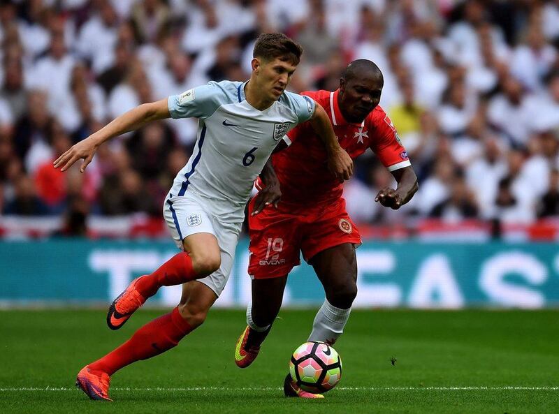 John Stones of England battles Alfred Effiong of Malta. Mike Hewitt / Getty Images