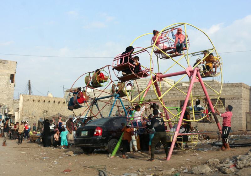 Children play at a neighbourhood fair in the southern Yemeni city of Lahj.