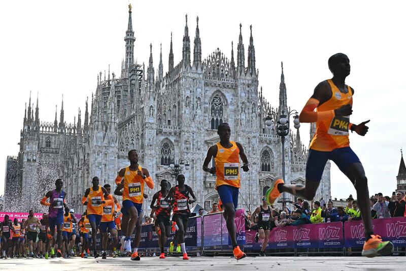 Athletes at the start of Milan's marathon at Piazza Duomo. AFP
