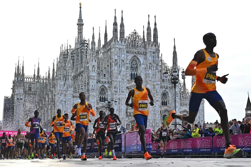 Athletes at the start of Milan's marathon at Piazza Duomo. AFP