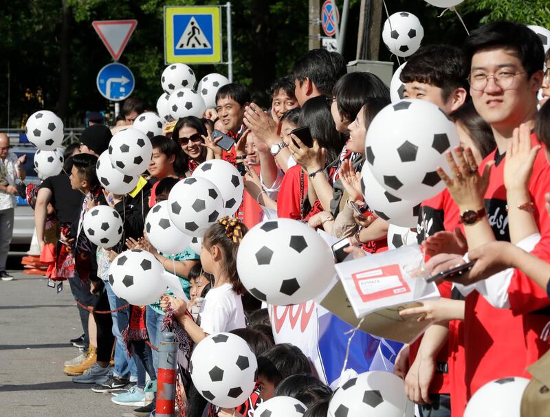 South Korea's supporters hold football-shaped balloons on their side's arrival at the team hotel in Saint Petersburg. AP