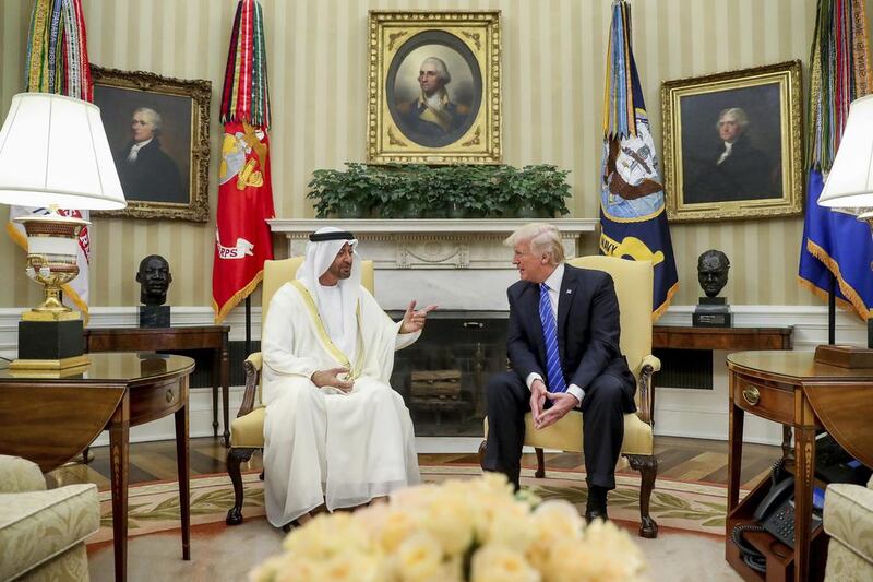 President Donald Trump speaks with Abu Dhabi's Crown Prince Sheikh Mohammed bin Zayed in the Oval Office of the White House in Washington