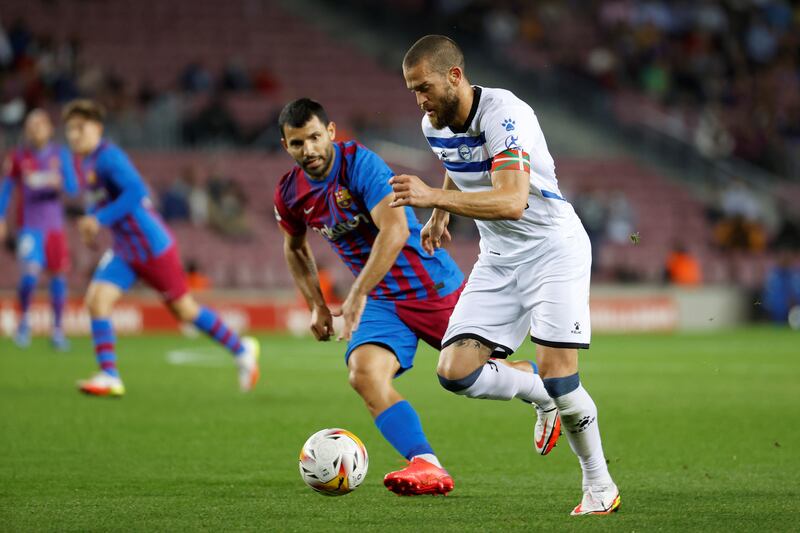 Barcelona striker Sergio Aguero vies for the ball with Alaves defender Victor Laguardia. EPA