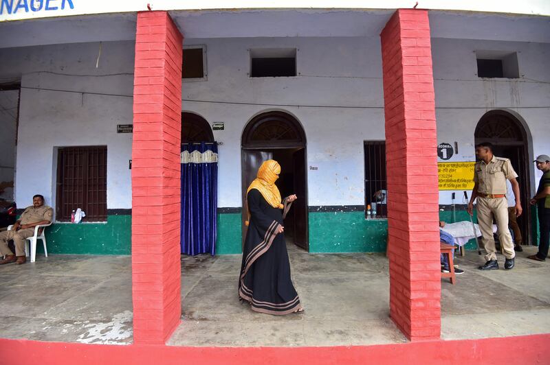 A woman leaves a polling station during municipal elections in Uttar Pradesh, India. AFP