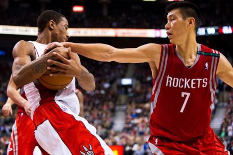 Houston Rockets' Jeremy Lin fouls Toronto's DeMar DeRozan.