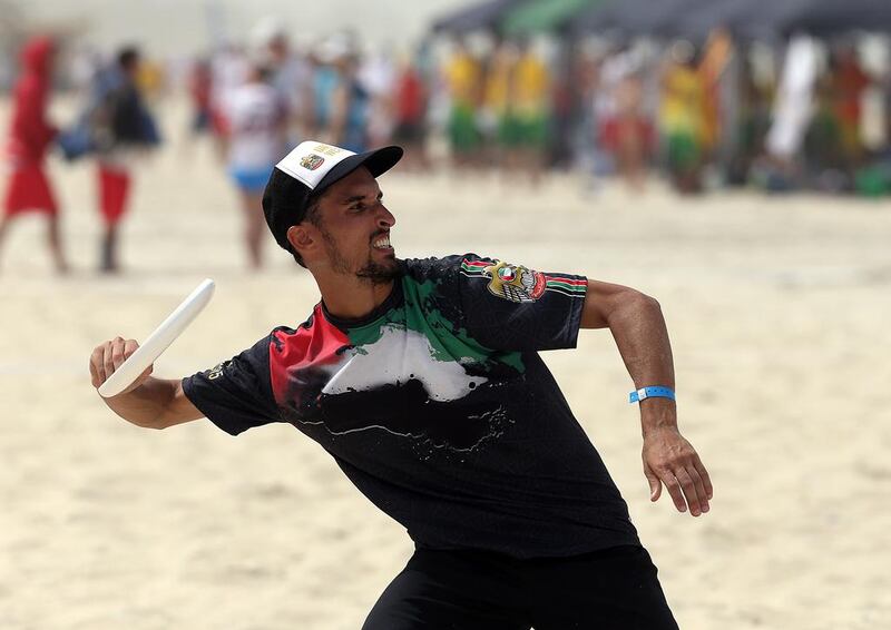 UAE player Alex Niswander  in action against Qatar during the 2015 World Championships of Beach Ultimate (WCBU) at the JBR beach in Dubai. Satish Kumar / The National