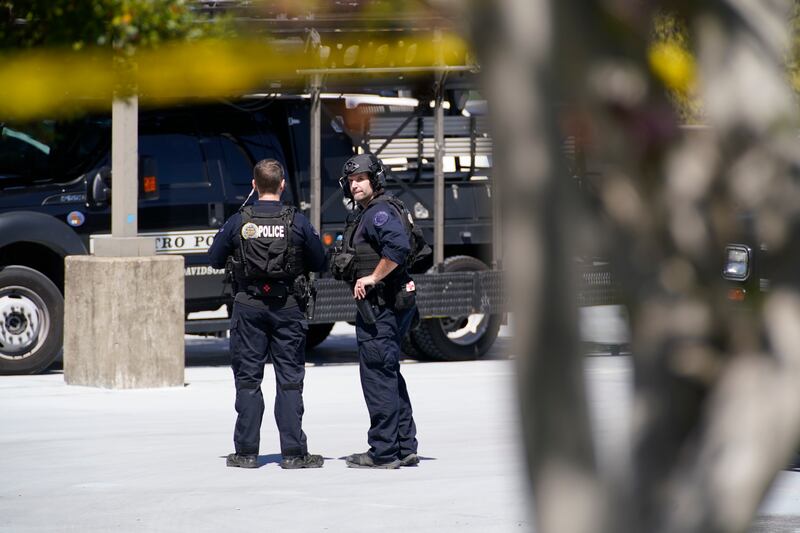 Police gather near the school in Nashville, Tennessee.  The Tennessean via AP