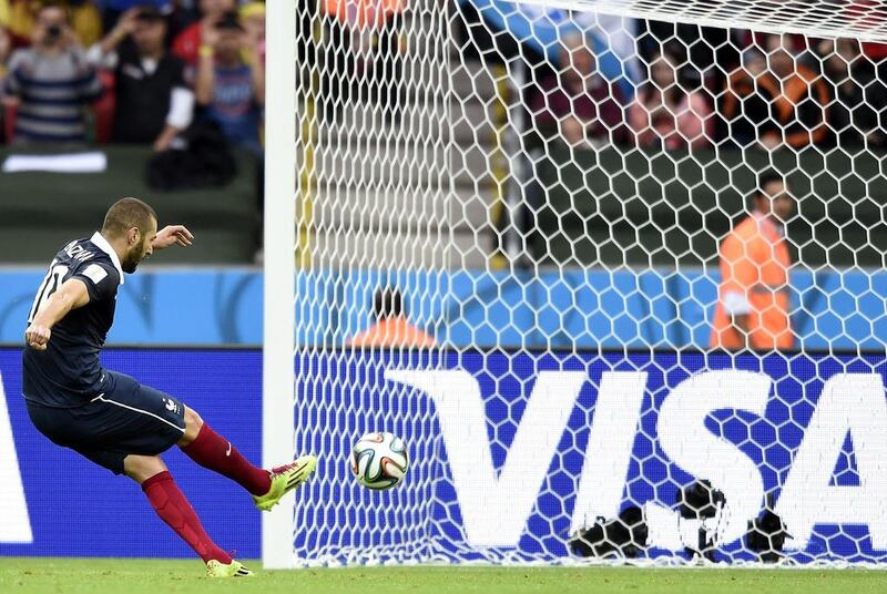 France forward Karim Benzema scores from the penalty spot for the first French goal on Sunday against Honduras in their 2014 World Cup Group E match on Sunday in Porto Alegre, Brazil. Franck Fife / AFP