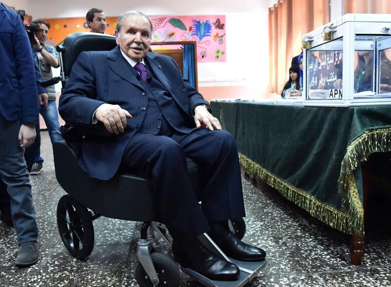 (FILES) In this file photo taken on May 04, 2017 Algerian President Abdelaziz Bouteflika is seen on a wheelchair as he casts his vote at a polling station in Algiers.  Algeria will hold it's next presidential elections in nine months. Bouteflika, 81, has been in power since 1999. / AFP / RYAD KRAMDI
