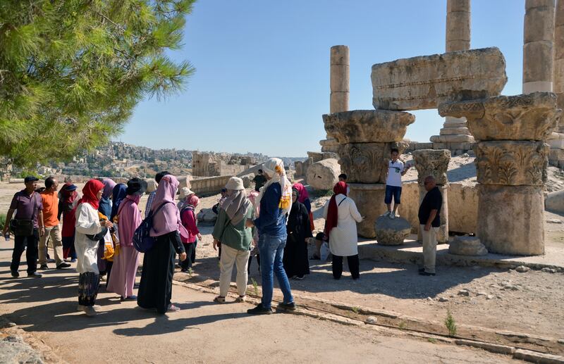 Visitors at the Amman Citadel, Jordan. The Ministry of Tourism and Antiquities and the Jordan Tourism Board are busy with efforts to attract citizens to their country's ancient heritage under a programme called Urdun Jannah.