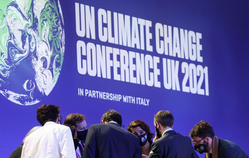 Delegates talk during the UN Climate Change Conference (Cop26) in Glasgow, Scotland. Reuters