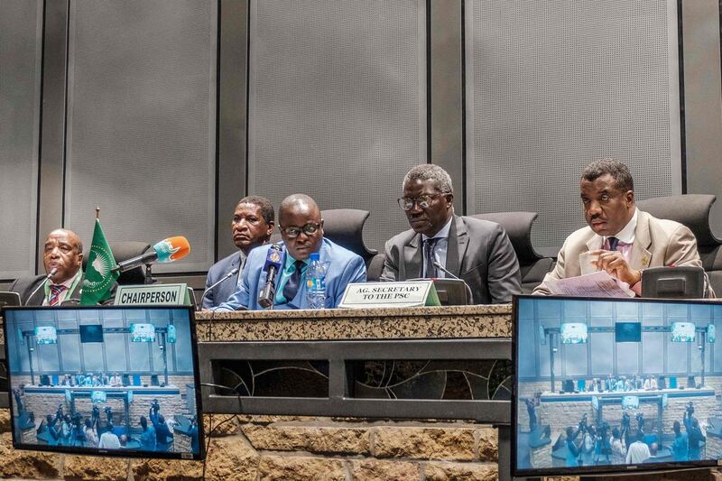 Permanent Representative of Sierra Leone and Chairperson of the African Union Peace and Security Council Patrick Kapuwa (C) speaks during a press briefing regarding the situation of Sudan at the African Union, in Addis Ababa, on June 6, 2019. The African Union on June 6, 2019 suspended Sudan, demanding a civilian-led transition authority to resolve a crisis which has claimed over 100 lives. "The AU Peace and Security Council has with immediate effect suspended the participation of the Republic of Sudan in all AU activities until the effective establishment of a Civilian-led Transitional Authority, as the only way to allow the Sudan to exit from the current crisis," the AU posted on Twitter. / AFP / EDUARDO SOTERAS
