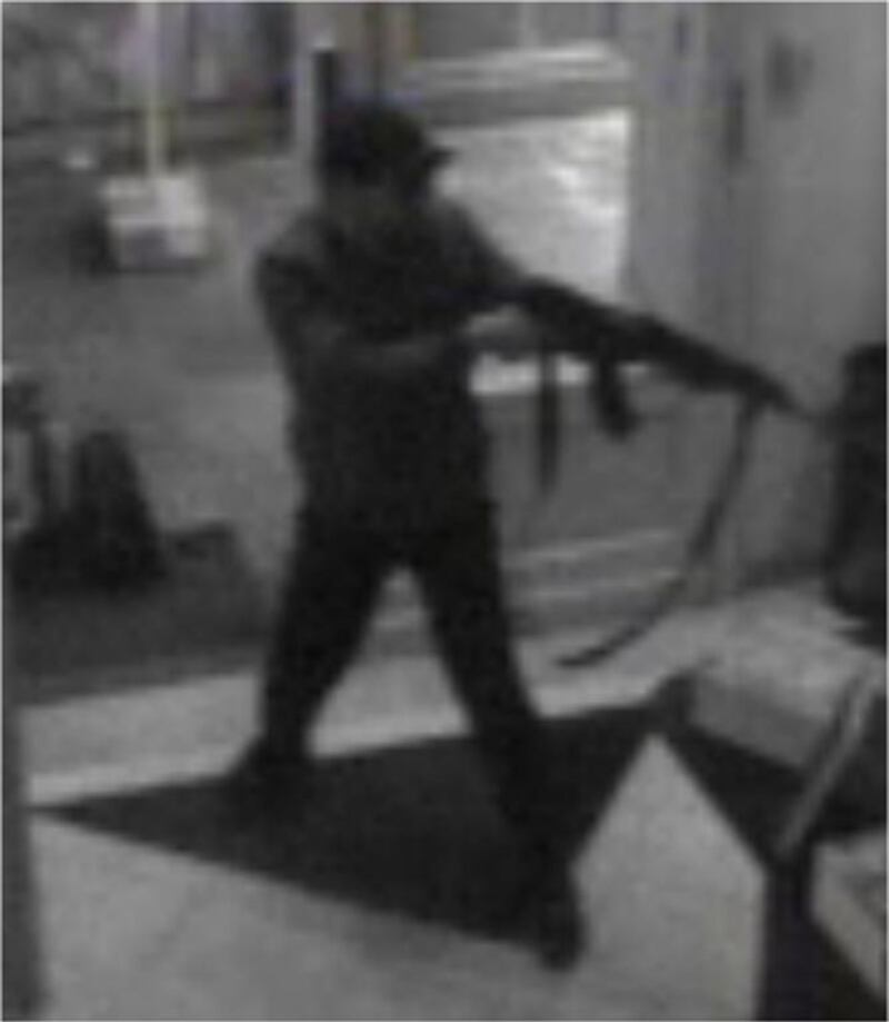 An image from CCTV security camera footage of the suspect in Saturday's Jewish Museum shooting in Brussels entering the building. Police Federale / EPA