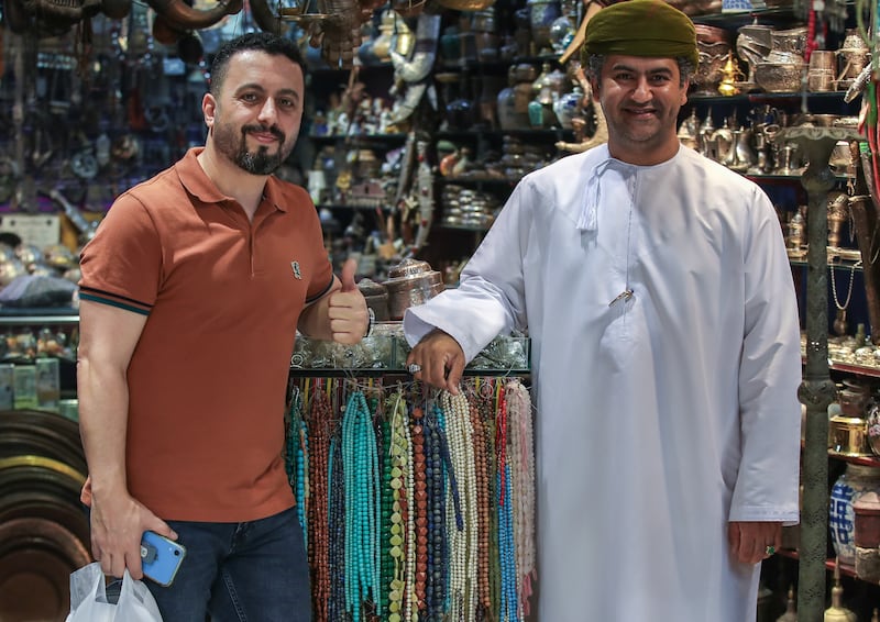 Mr Al Balooshi with a customer.