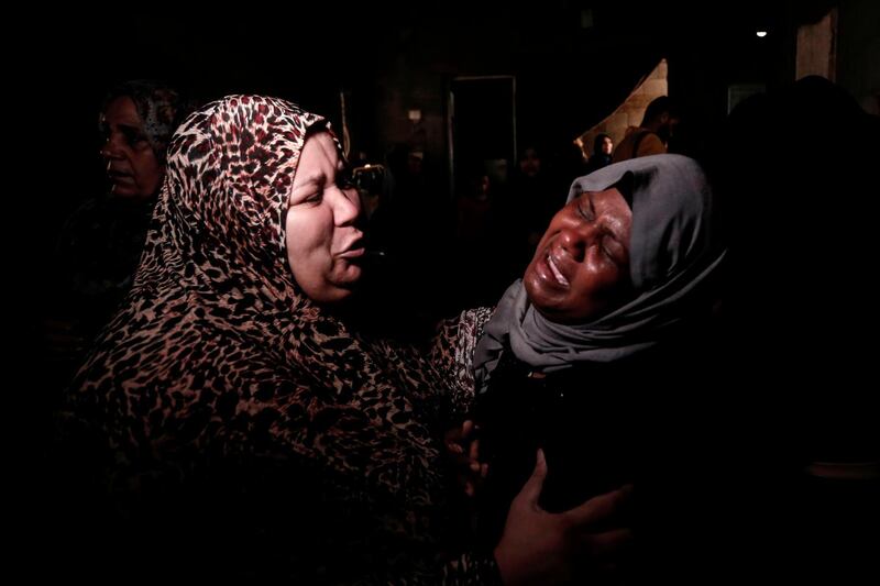 Palestinian relatives of Ahmad Murjan, the young Hamas fighter killed by Israeli fire, mourn his death during the funeral in Jabalia, in the northern Gaza Strip. AFP