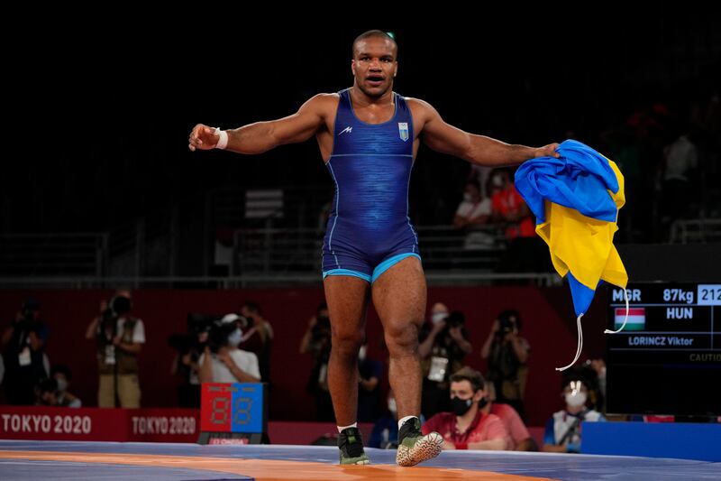 Ukraine's Zhan Beleniuk celebrates after winning gold in the men's 87kg Greco-Roman wrestling.
