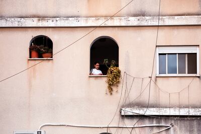 A girl at a window near the scene of the mass shooting in Nazareth. Reuters