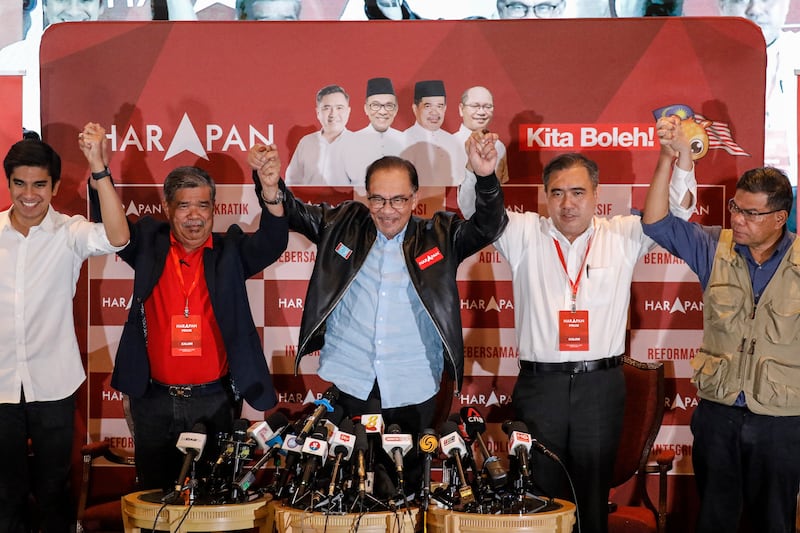 Malaysian opposition leader Anwar Ibrahim, centre, with senior leaders of his Pakatan Harapan coalition in Subang, a suburb of Kuala Lumpur on Sunday. Mr Anwar has been on the cusp of power several times in his political career. EPA