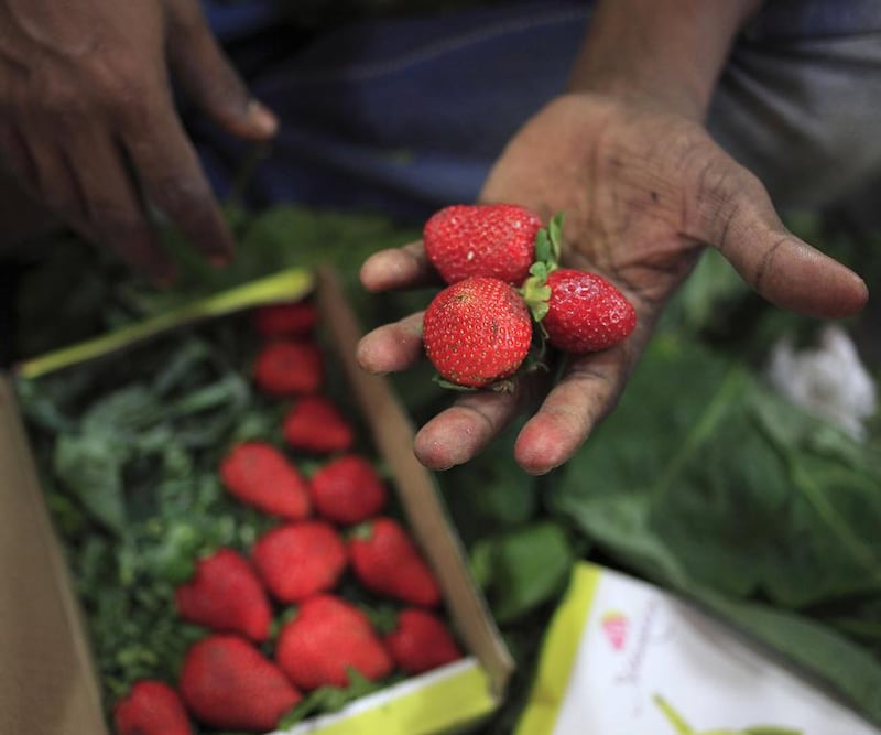 One of the major things to buy at Crawford market is fresh produce such as fruits and vegetables, including these strawberries. Subhash Sharma for The National