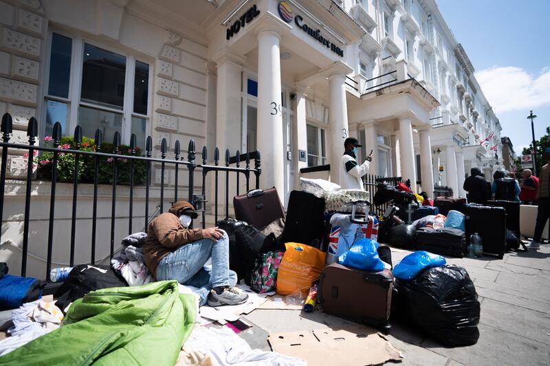 Migrants camped outside the Comfort Inn hotel in Pimlico, central London, in June in protest after being told they would be sleeping four to a room. PA