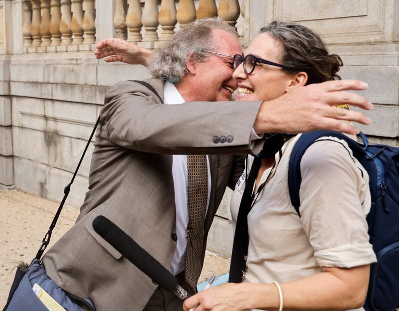 Lawyer Chris Flohr embraces podcaster Sarah Koenig. Reuters