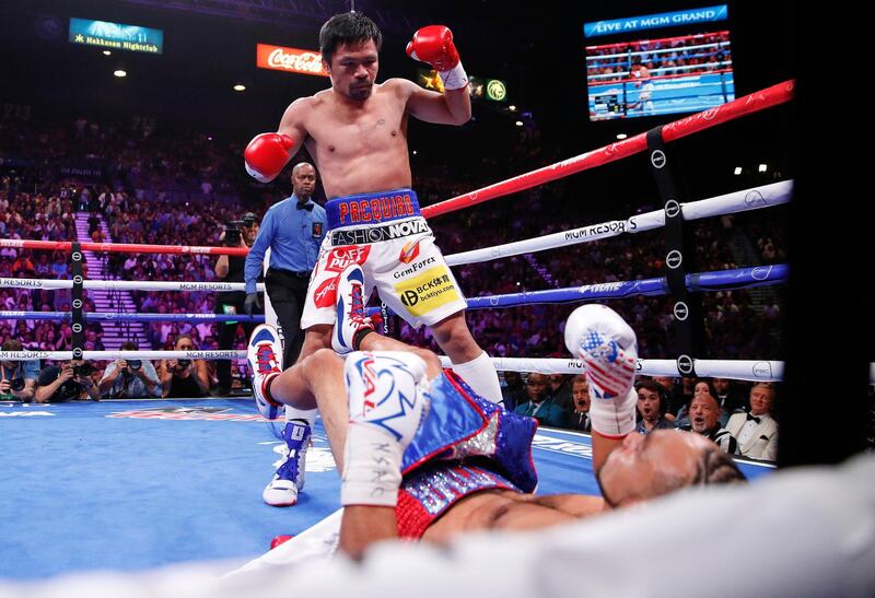Manny Pacquiao reacts after knocking down Keith Thurman in the first round. AP Photo