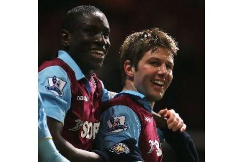 Demba Ba, left, and Thomas Hitzlsperger celebrate during West Ham's FA Cup win over Burnley. Paul Gilham / Getty Images