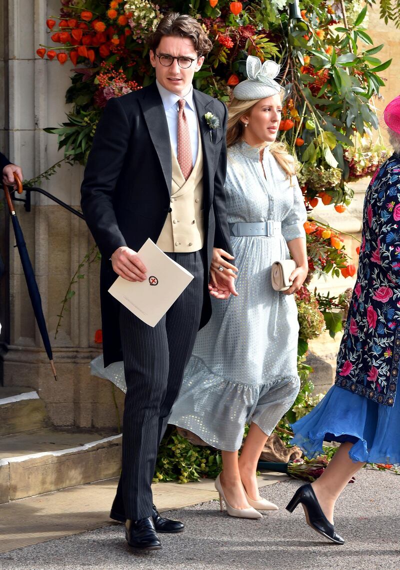 FILE - In this Oct. 12, 2018 file photo,  Caspar Joplin, left, and singer Ellie Goulding depart after the wedding of Princess Eugenie of York and Jack Brooksbank at St George's Chapel, Windsor Castle, near London, England.  Goulding married Jopling in a lavish ceremony Saturday, Aug. 31, 2019 with pals Katy Perry, Orlando Bloom and Sienna Miller in attendance. The two tied the knot in Yorkshire, England, at the gothic York Minster Cathedral.(Matt Crossick, Pool via AP, File)