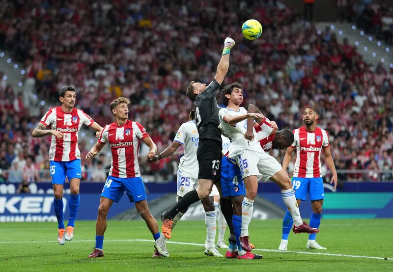 Jan Oblak of Atletico Madrid battles with Jesus Vallejo of Real Madrid. Getty Images